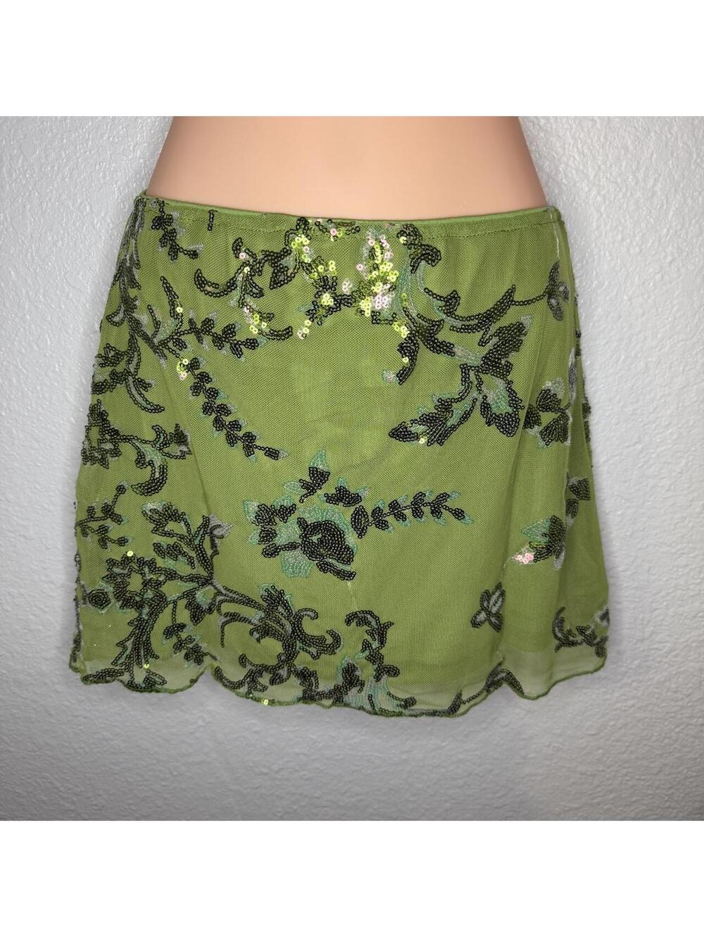 Green beaded mini skirt with black floral embroidery and sequins